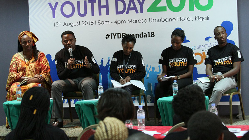 Edouard Bamporiki, the Chairman of National Itorero Commisssion (2nd left), speaks on a panel during the celebration of the International Youth Day in Kigali yesterday. (All photos by Diane Mushimiyimana)