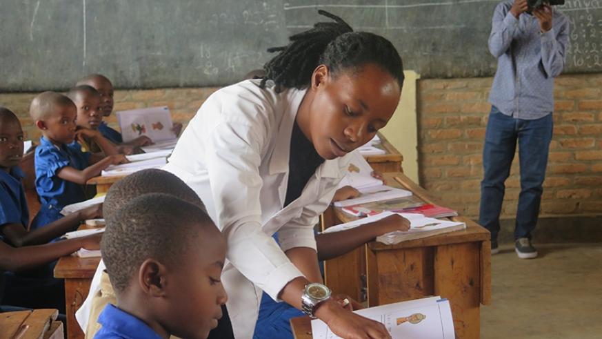 A teacher engages students in a lesson as EDT officials toured to assess the challenges facing teachers during their teaching practices. 