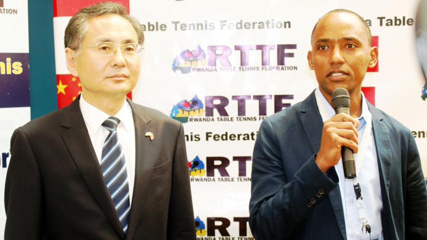 John Birungi (right), the president of Rwanda Table Tennis Federation speaks at Ambassadoru2019s Cup in Remera last month. On the left is Chinese Ambassador to Rwanda, RAO Hongwei. Courtesy photo.