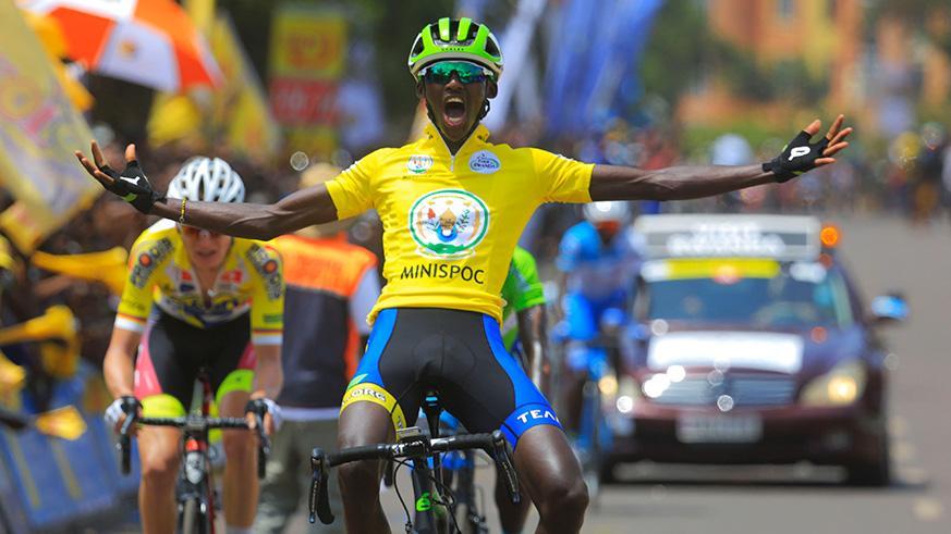 20-year-old Rwandan rider Samuel Mugisha celebrates on crossing the finish line outside Kigali Stadium in Nyamirambo. File.
