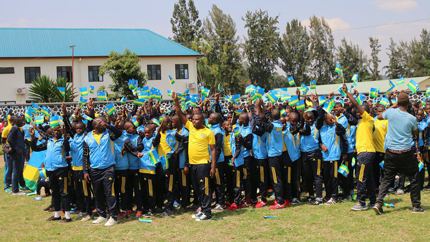 Some of the teams representing Rwanda at the 2018 FEASSSA Games wave the national flag during the official opening ceremony. Regis Umurengezi