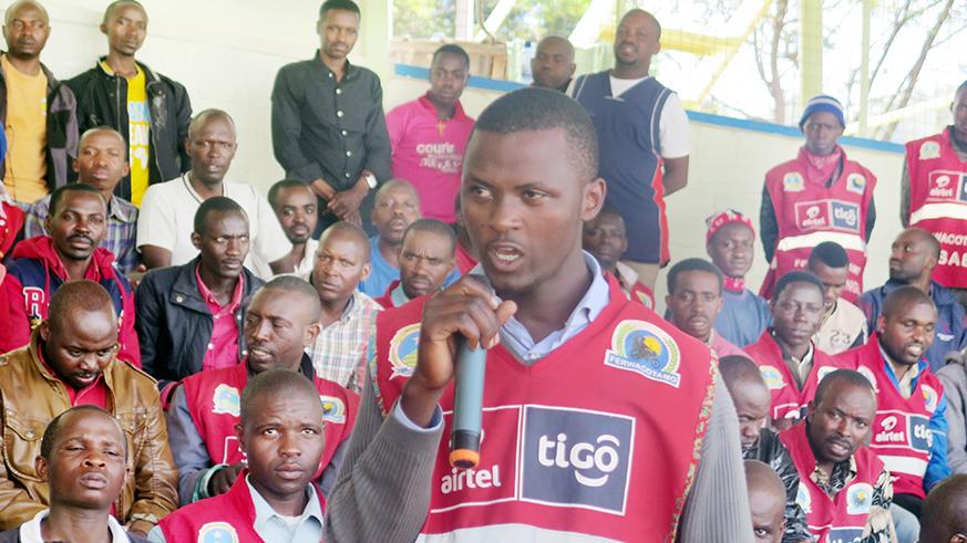 A motorcyclist asks a question during a meeting between various government institutions and members of taxi-moto cooperatives at Kigali Stadium in June. File.