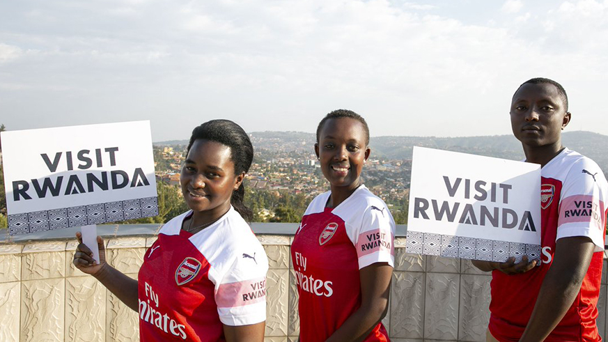 Some of Arsenal Jersey winners Elican Ngango, Liliane Inshuti and Prossy Namusisi. Courtesy. 