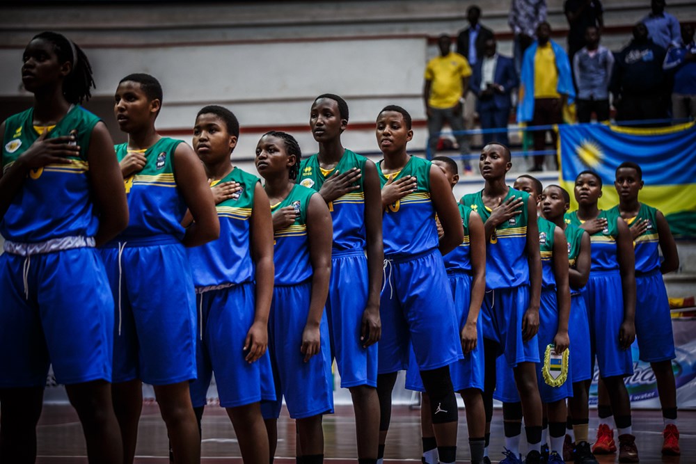 Rwanda's U18 women's basketball team line-up to sing the national anthem before facing Mozambique last Sunday. Courtesy