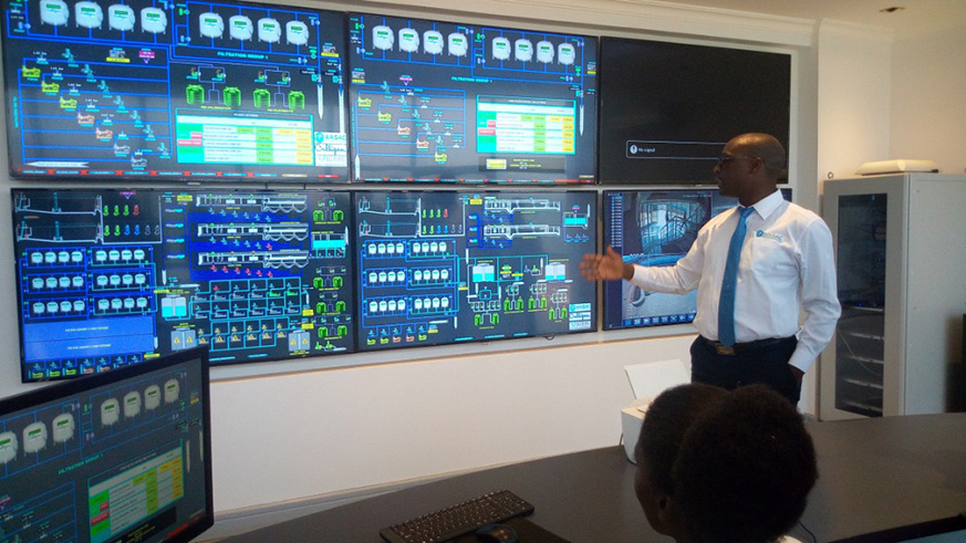  Aimu00e9 Muzola, WASAC Chief Executive Officer, explains about the new technology used in water system monitoring during a media tour at Nzove water treatment plant. / Diane Mushimiyimana