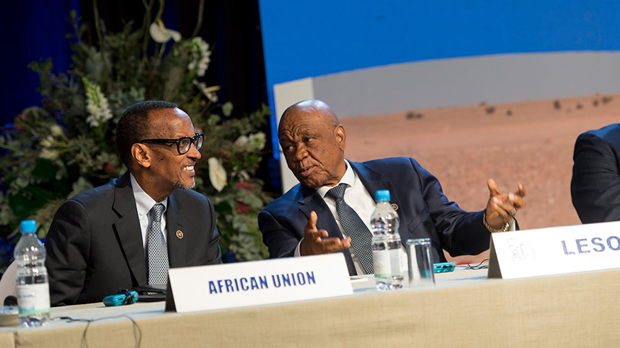 President Kagame chats with the Prime Minister of Lesotho Thomas Thabane at the 38th SADC summit in Windhoek in Namibia yesterday. Village Urugwiro.