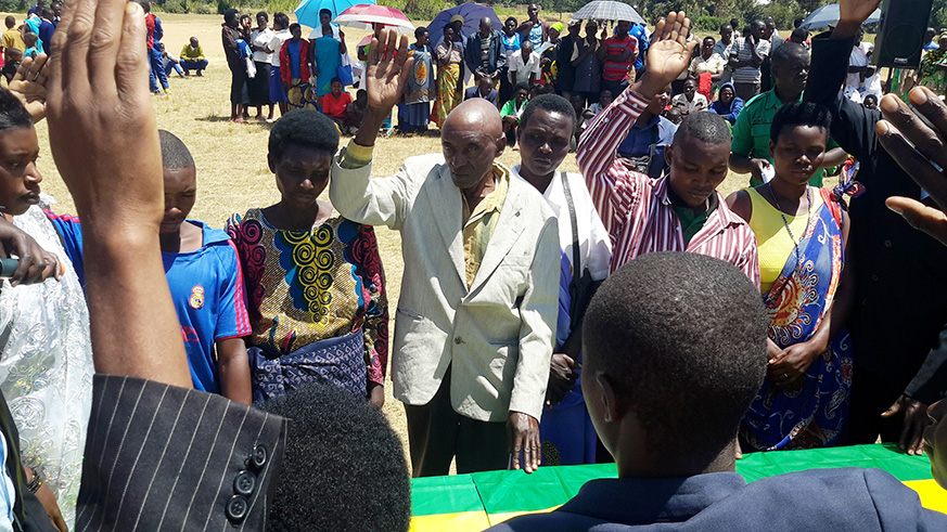 A group of cohabiting couples legalise their union in Gicumbi District. Ndejeje (in white jacket) cohabited with two wives for 27 years but after sensitisation on familyu2019s safety by government and its partners, he finally opted for a legal monogamous union. Regis Umurengezi.