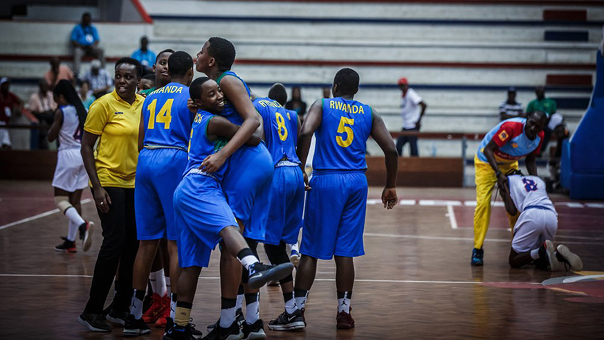 Rwandan players celebrate after edging out DR Congo 49-44 at Pavilhao Maxaquene Stadium in Mapouto yesterday. Courtesy.