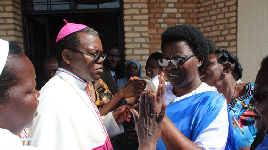Mukamazimpaka waves at Chritians at Kibeho, Gikongoro Diocese where it is believed the Virgin Mary appeared to her and two other young girls nearly four decades ago. Jean du2019Amour Mbonyinshuti .