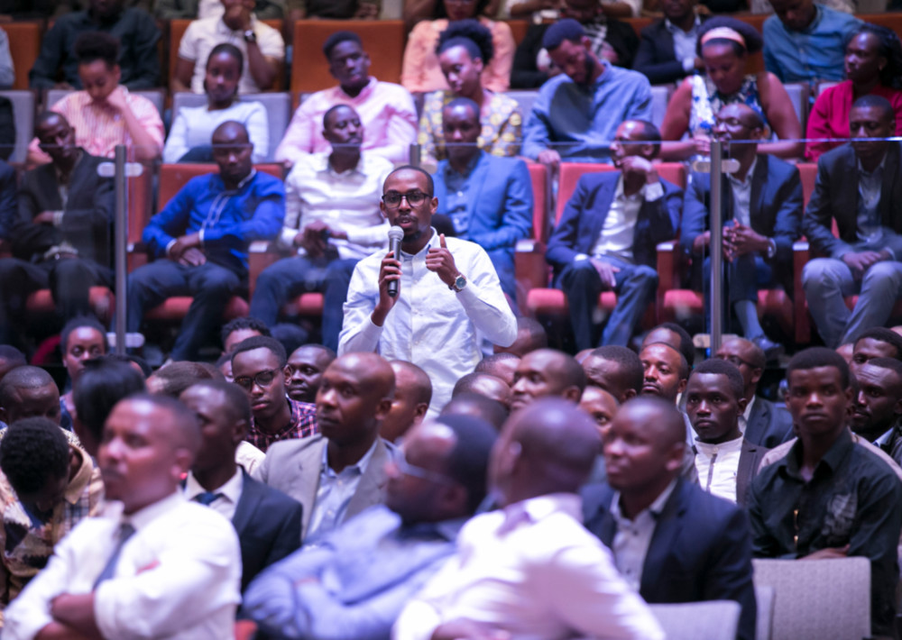 Local businessman Ephraim Rwamwenge asks a question to the President during the meeting with Young Professionals last Sunday. / Village Urugwiro