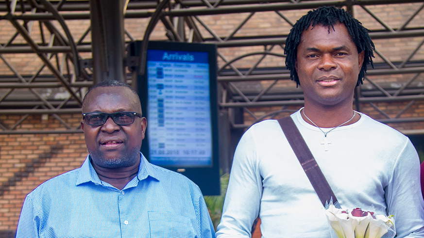Upon his arrival at Kigali International Airport, McCarthy Ugochukwu Okpara (right) was received by Rayon Sports' Secretary General Bernard Itangishaka (left) on Tuesday afternoon. /Faustin Niyigena