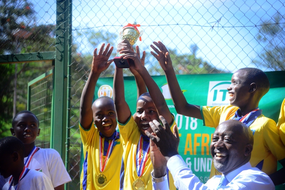 The national U12 boysu2019 team celebrates with the trophy after winning the regional East African U12 Championship at Kigali Sports Centre in March this year. File photo.