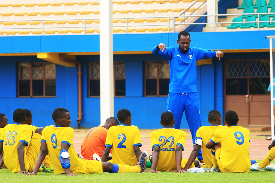 Yves Rwasamanzi gives instructions to his players during a past training session at Amahoro Stadium. File photo