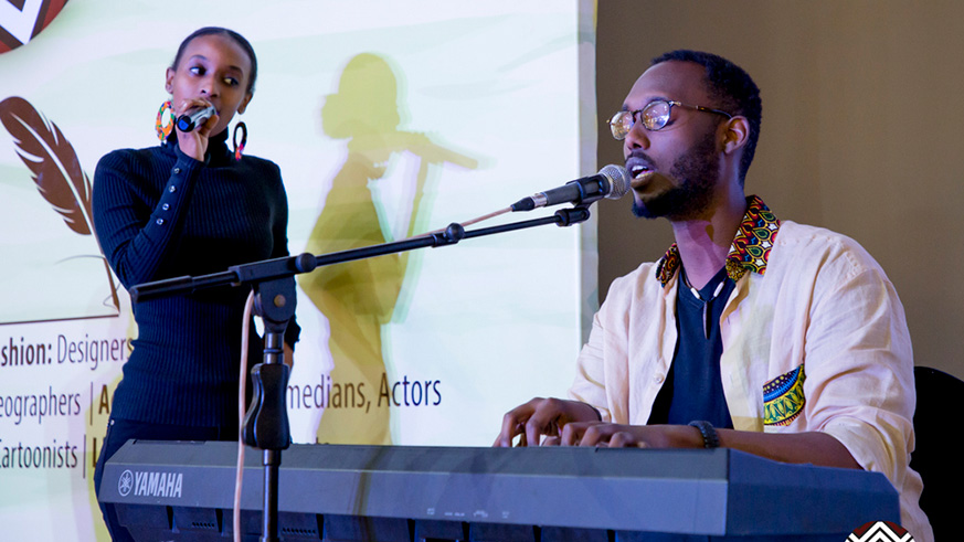 Rwandan artists Mike Kayihura (playing piano) and Angel Mutoni performed in Kigali yesterday at the launch of ArtRwanda-Ubuhanzi, a talent search project that aims at boosting the countryu2019s creative industry.