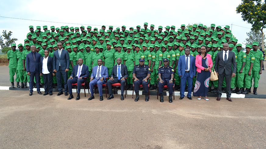 Officials posing for a group photo with DASSO's new members after the pass-out ceremony