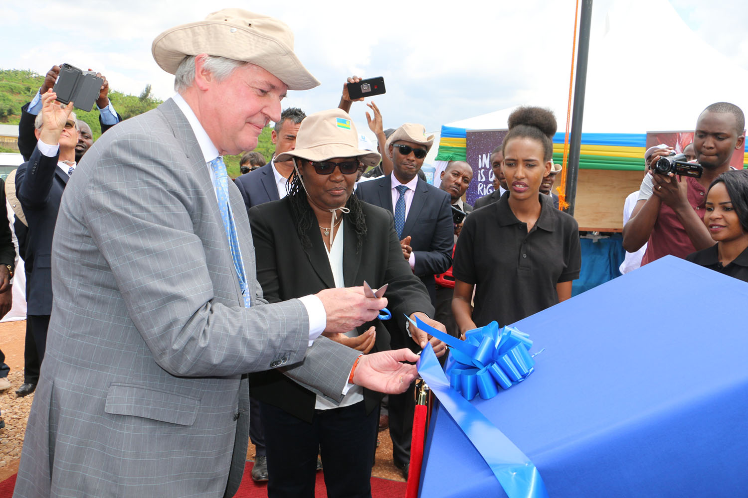 Unilever Chief Executive Officer, Paul Polman (left), and the Minister for Agriculture and Animal Resources, Gerardine Mukeshimana, cut the ribbon during the launch of a Unilever tea project in Kibeho, Nyaruguru District last year. Unilever is a UK company. Courtesy.
