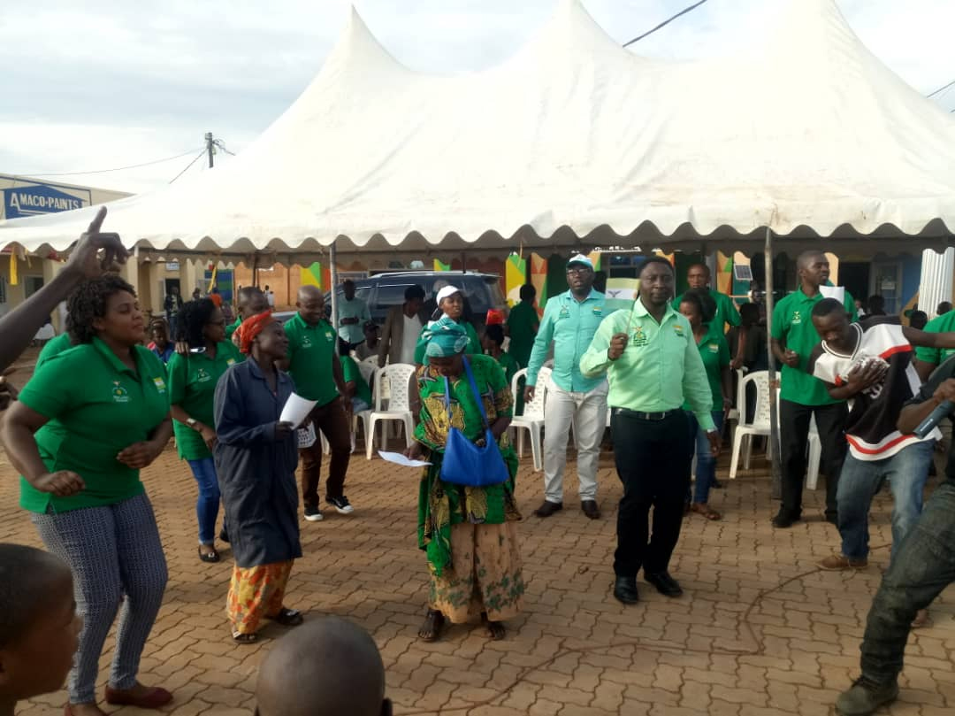 Green Party's Frank Habineza dances with party members and some of voters in Gahanga, Kicukiro district