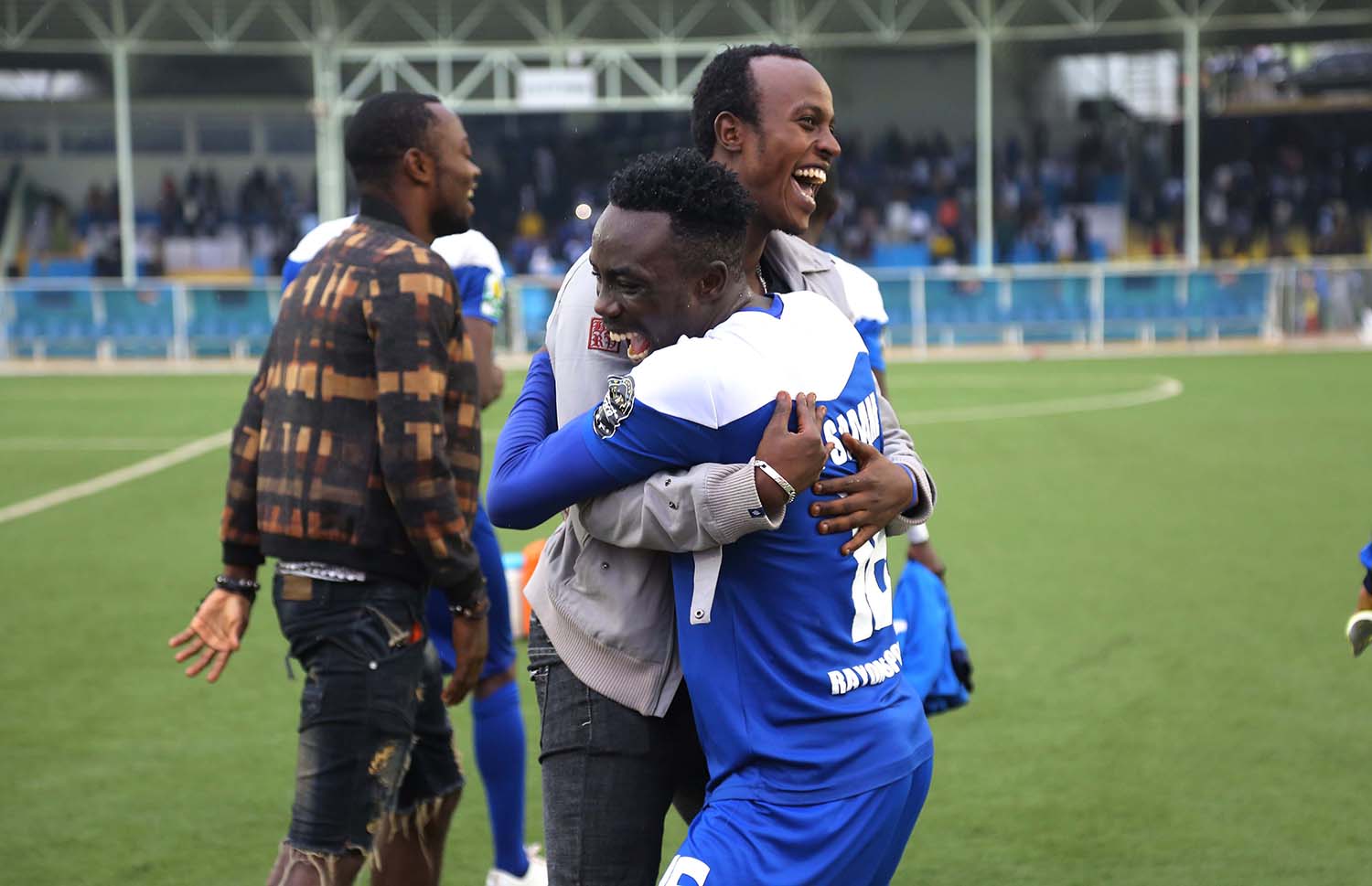 Midfielder Seph Niyonzimana congratulates his teammate Right-back Saddam Nyandwi after the match