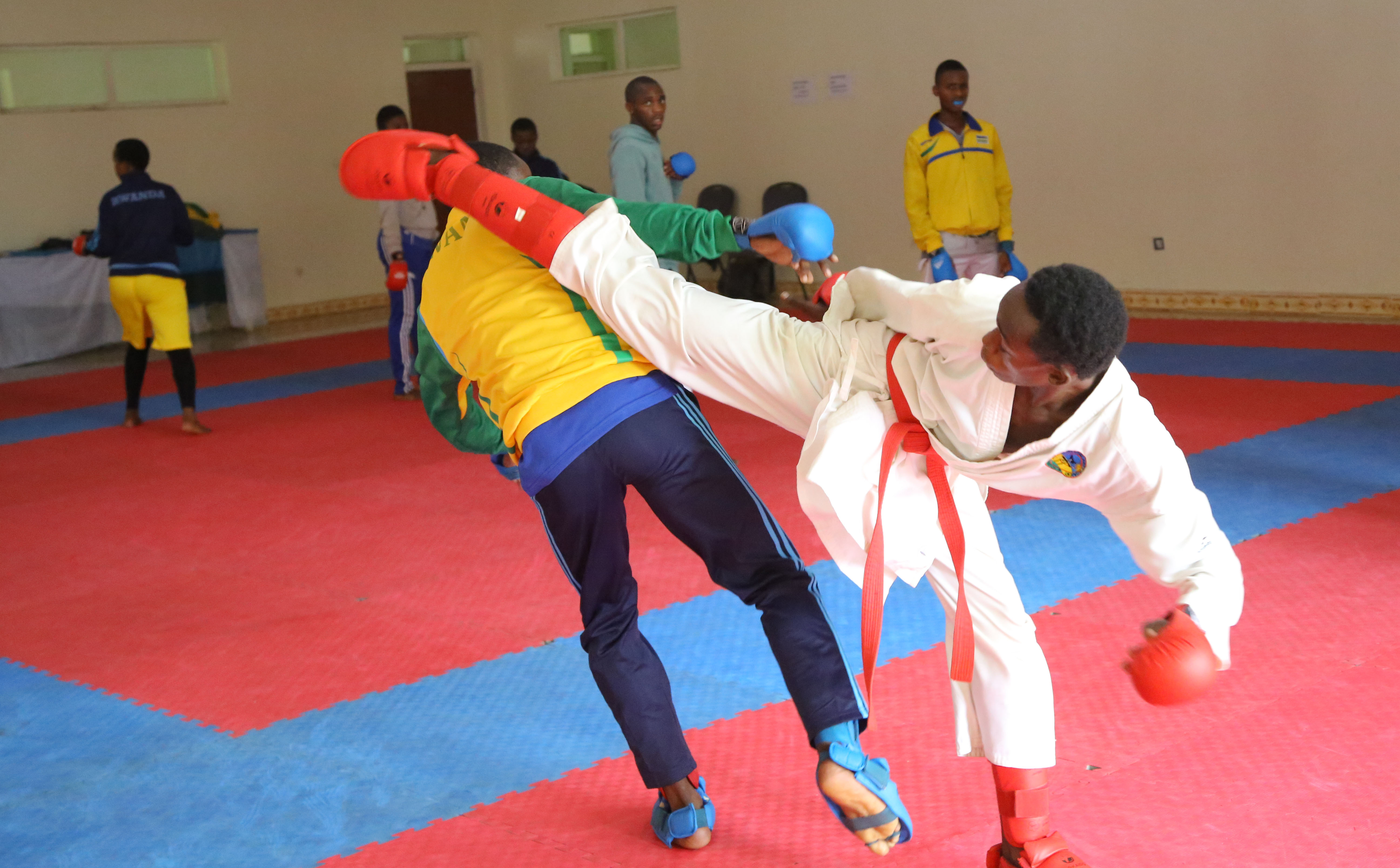 National team player Mike Shyaka, 17,  attempts an Ura Mawashi Geri (Karate hook kick) on Fiston Ntwari during Monday's training session in Kigali. Sam Ngendahimana