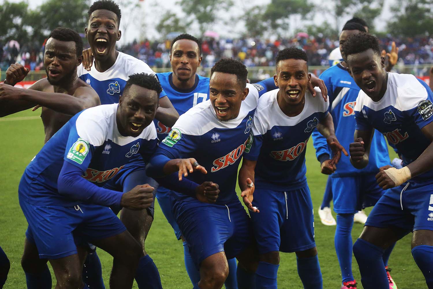 The Blues players celebrate their crucial victory at Kigali Stadium