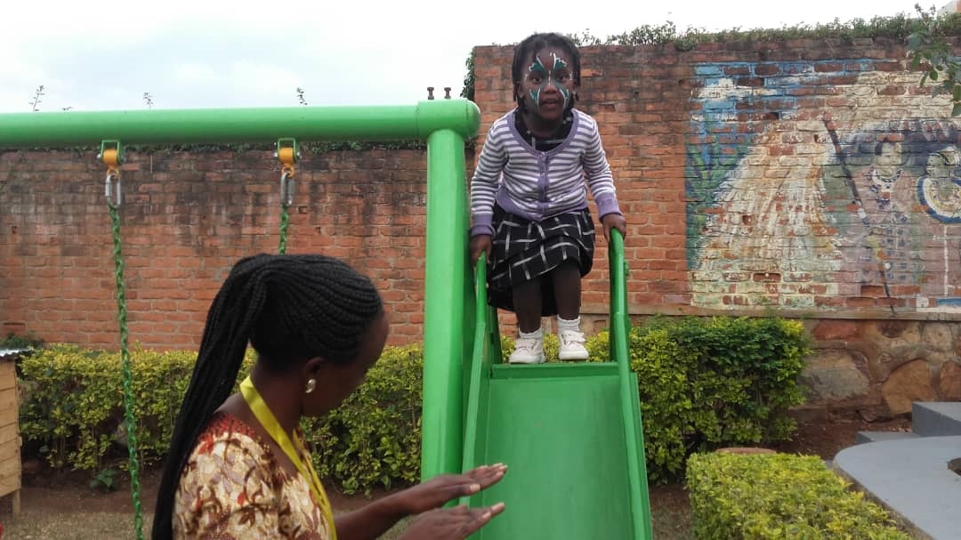 Mutesi monitors a child during playtime.  /Photos by Michel Nkurunziza 