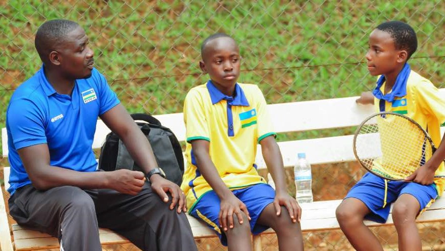 Coach Eric Bimenyimana (left) is seen here giving instructions to his players during the East Africa regional qualifiers earlier this year in Kigali. File photo