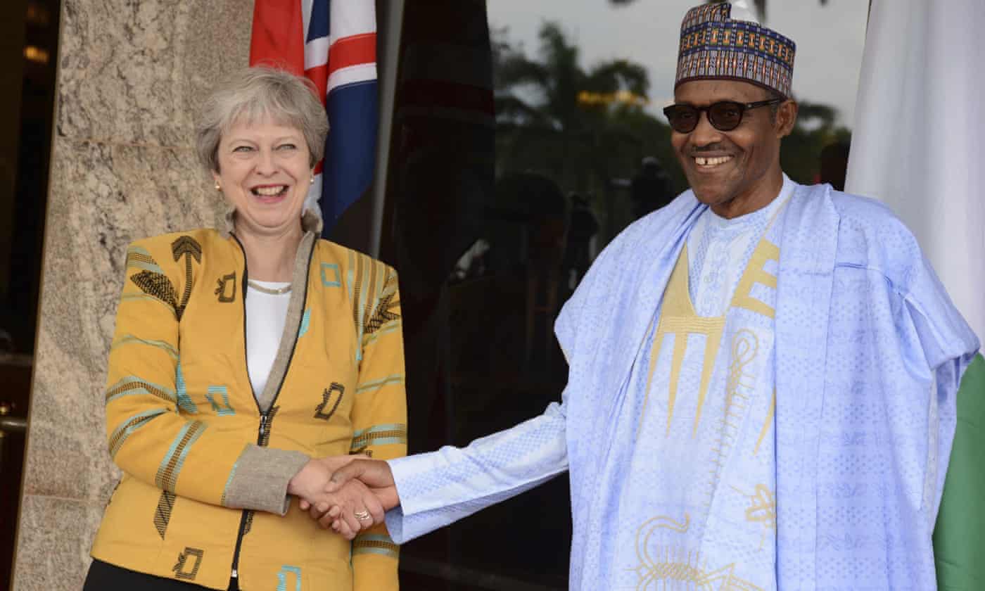 Theresa May shakes hands with Muhammadu Buhari, Nigeriau2019s president, at their meeting in Abuja. Net photo.