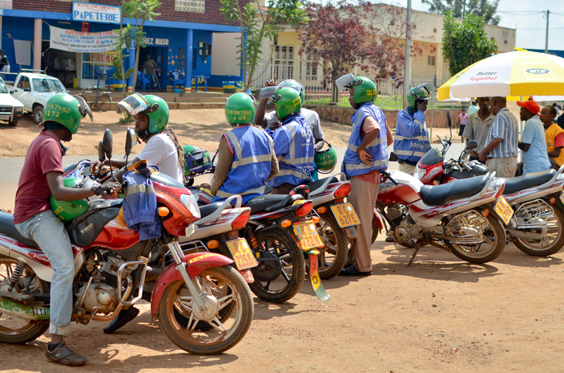 Taxi-moto riders wait for passengers. File photo