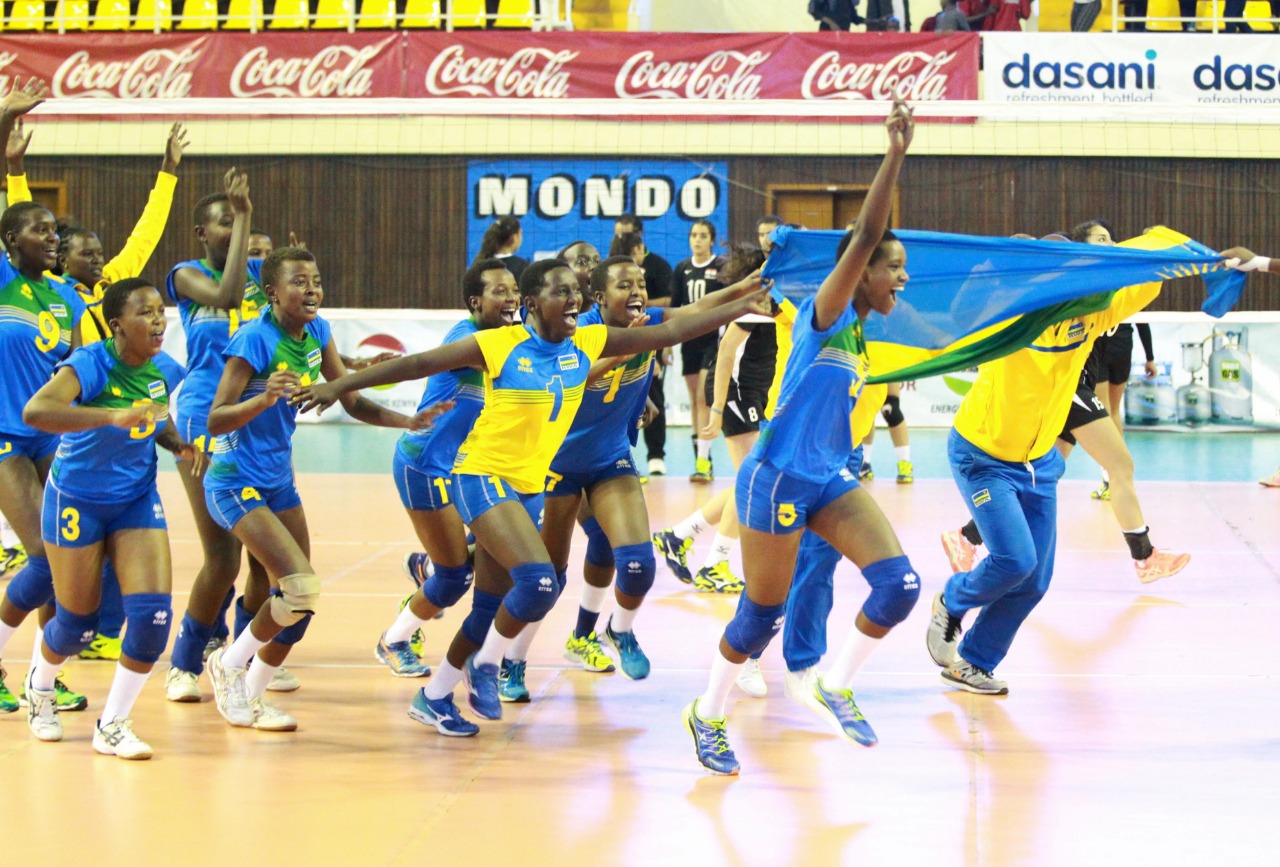 Rwandan players and the technical staff celebrate after edging out Cameroon at Kasarani Indoor Stadium in Nairobi on Friday night. The ladies effectively qualified for the 2019 FIVB World U20 Championships. Courtesy.