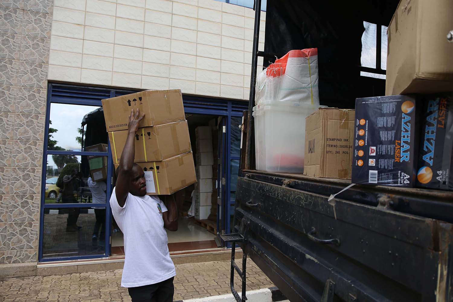 A National Electoral Commission (NEC) staff loads a truck with materials and equipment that will be used during the parliamentary elections next week. NEC yesterday started dispatching voting materials to polling stations across the country, a step officials said is one of the last stages in the preparations for Mondayu2019s parliamentary elections. Sam Ngendahimana. 