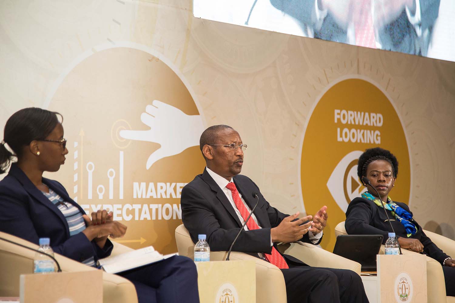 Central bank governor John Rwangombwa (centre) speaks during the Monetary Policy and Financial Stability Statement presentation as Monique Nsanzabaganwa, Vice Governor (right) and Peace Uwase, Director General of the Financial Stability at BNR, look on at Kigali Convention Centre yesterday. Nadege Imbabazi.