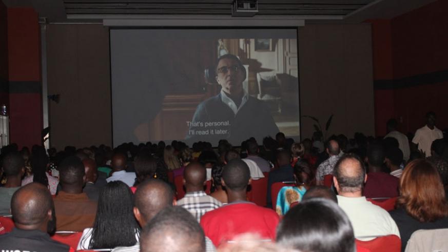 Film lovers relish one of the movies that were screened on the night. 