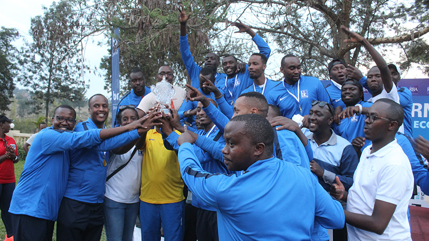 Bank of Kigali basketball team lift the trophy after edging Equity Bank in the final on Saturday. Courtesy