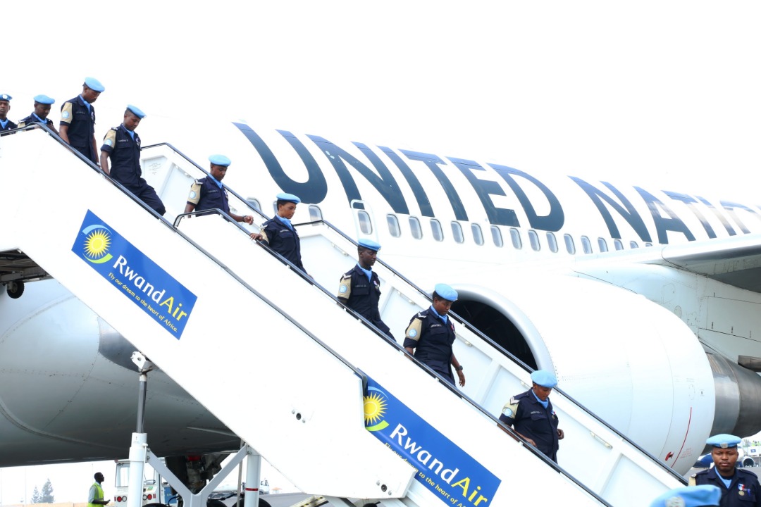 Members of the Rwandan police peacekeepers disembark from a plane on arrival at Kigali International Airport on Monday. Courtesy
