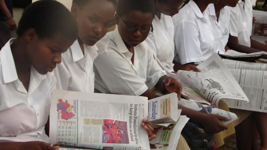 Students read newspapers at The New Times head office. File.