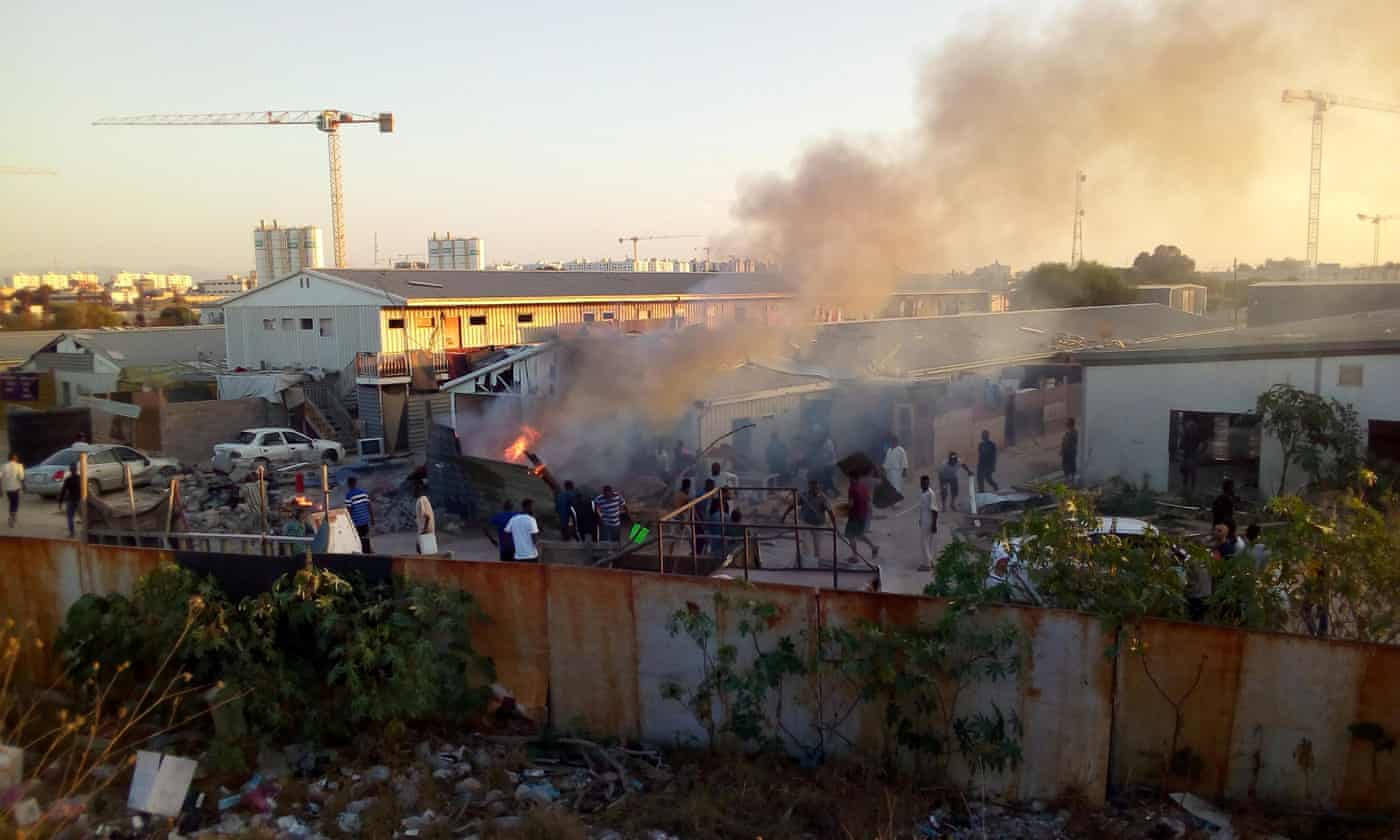 Smoke rises after a rocket hit a camp for displaced people during the fight between rival armed groups in Tripoli. Net photo.