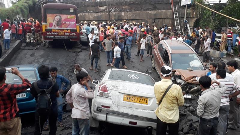 Rescue workers search for victims at the site of the bridge that collapsed in Kolkata. Net photo.