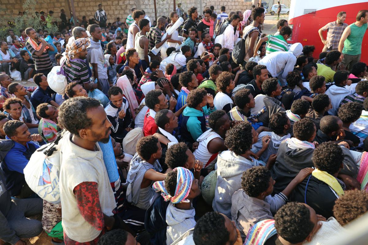 Migrants are seen after they were relocated from government-run detention centres, after getting trapped by clashes between rival groups in Tripoli, yesterday. Net photo.