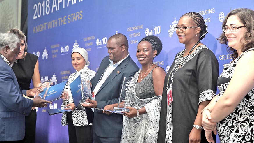 Dr Nsanzabaganwa (third right) recieving an award alongside her colleagues in Sochi, Russia. Courtesy.