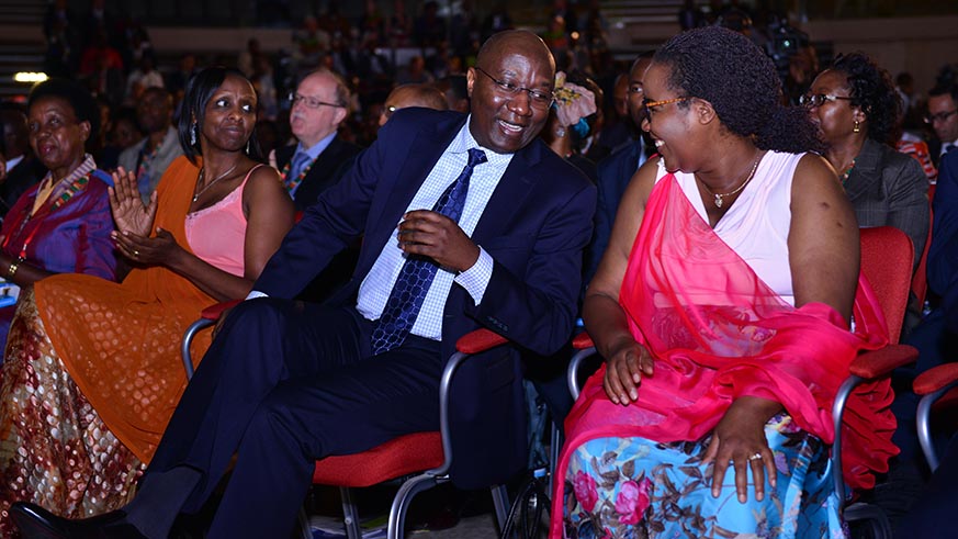 Prime Minister Ngirente chats with Minister Mukeshimana (right) as Kalibata looks on at the AGRF2018 forum in Kigali yesterday. Courtesy.