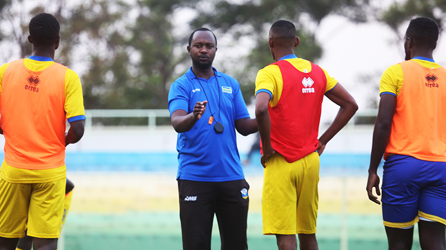 Amavubi head coach Vincent Mashami gives instructions to his players during a training session at Kigali Stadium early this week. 