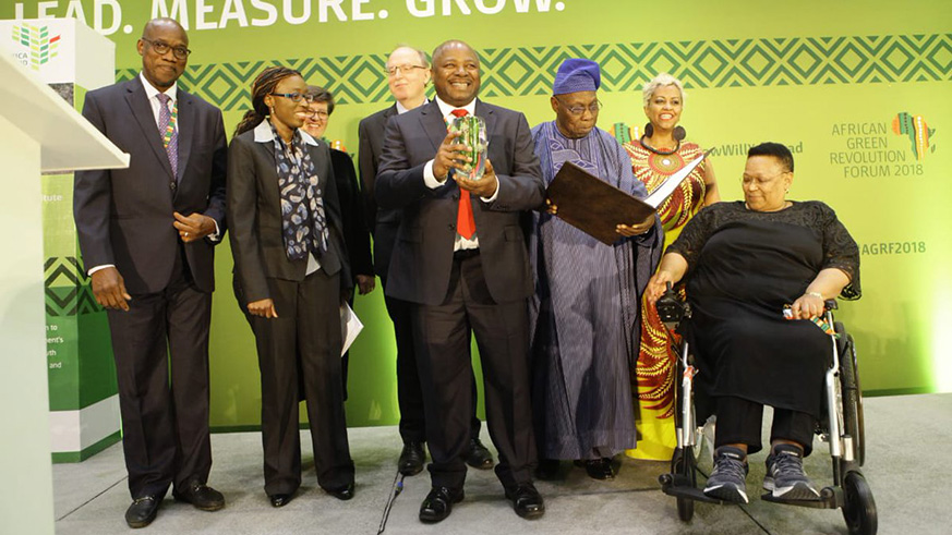 IITA Director-General, Dr Sanginga, pictured as he receives the Africa Food Prize, along with Olusegun Obasanjo, chairperson of Africa Food Prize Committee and its members in Kigali on Friday. Courtesy.