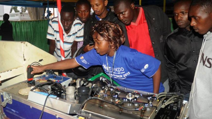 A student of mechanical engineering explains how an engine works during a TVET expo in Kigali. File.