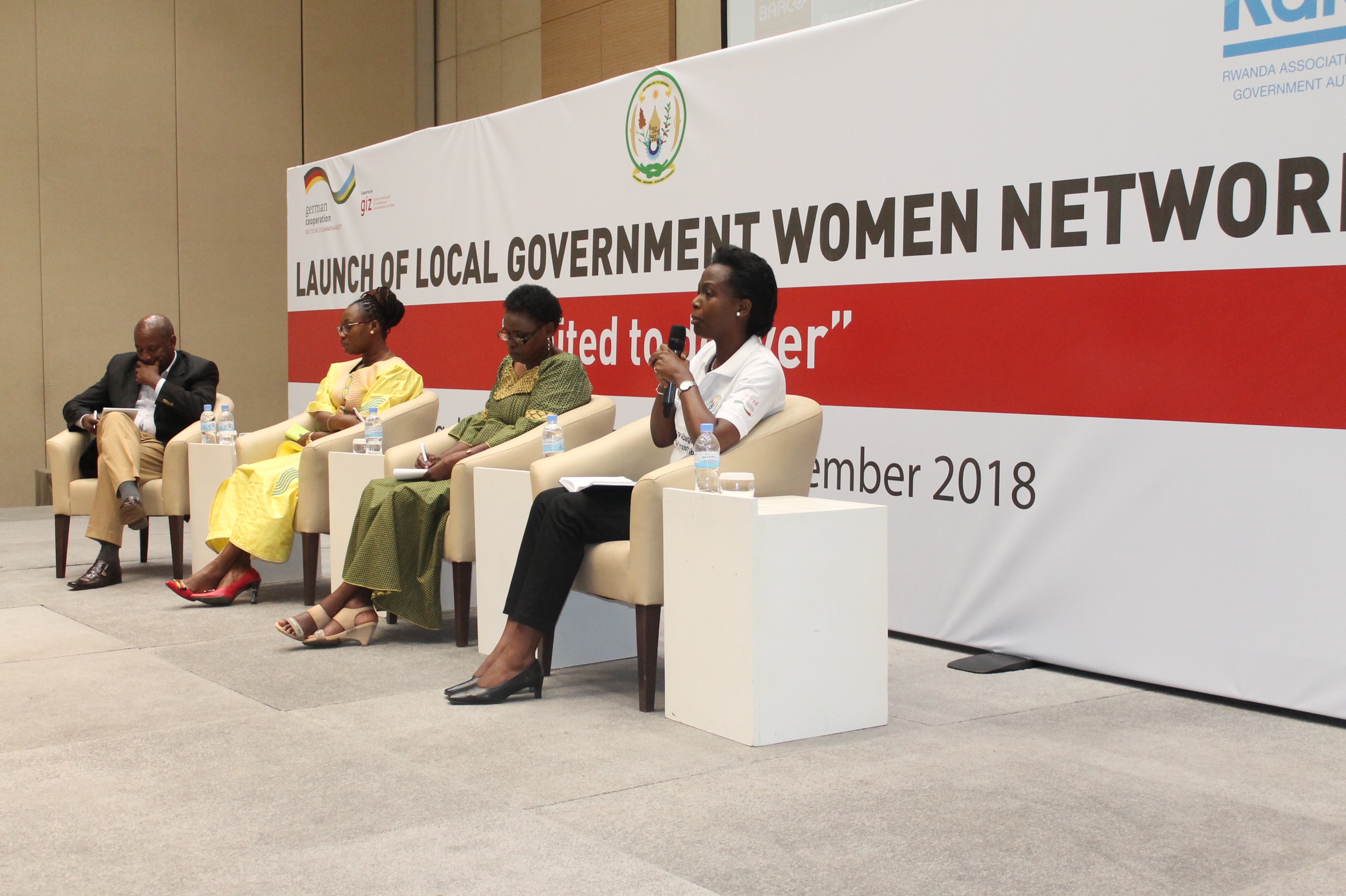 The ministers for Gender and Family Promotion and Local Government EspÃ©rance Nyirasafari (2nd R) and Francis Kaboneka (left) respectively, with newly elected head of Rwanda Network of Women in Local Government, Marie-Chantal Rwakazina (L), and the RALGA Chairperson Innocent Uwimana with the logo of the newly launched network yesterday. Courtesy.