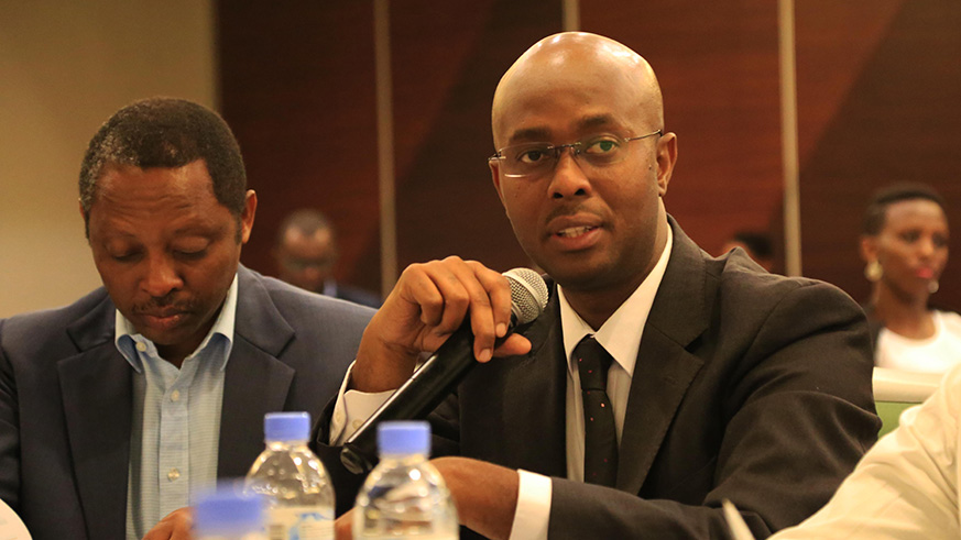 Yusuf Murangwa, the director-general of the National Institute of Statistics gives his point of view to the reports as RGB Chief Executive Officer Prof Anastase Shyaka looks on (Sam Ngendahimana)