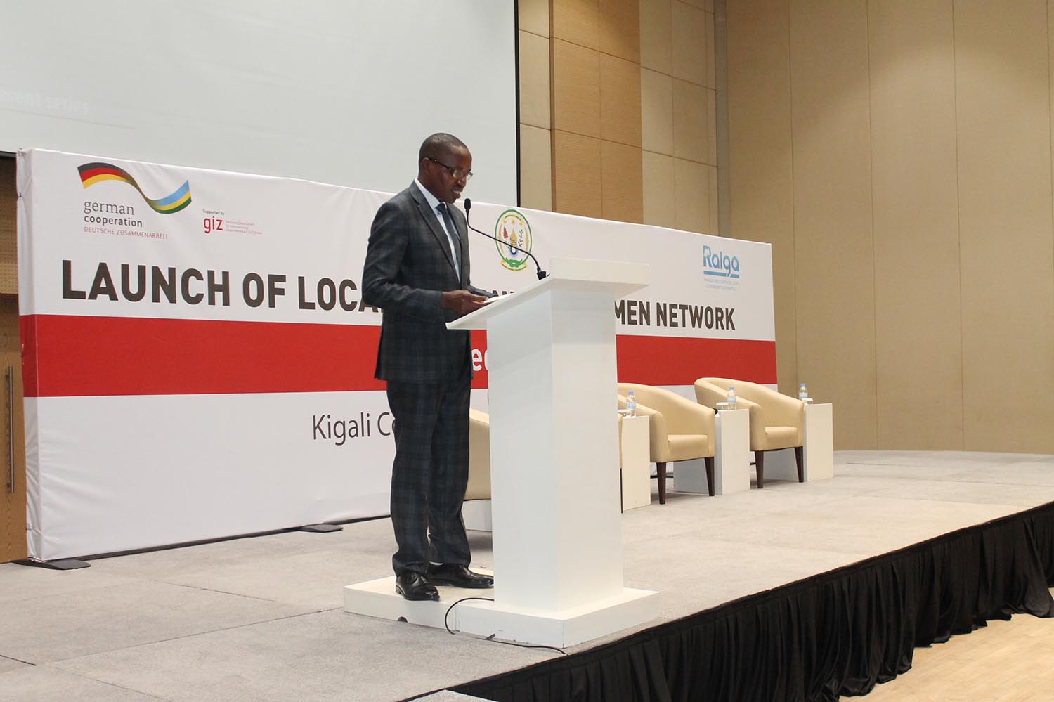 The ministers for Gender and Family Promotion and Local Government EspÃ©rance Nyirasafari (2nd R) and Francis Kaboneka (left) respectively, with newly elected head of Rwanda Network of Women in Local Government, Marie-Chantal Rwakazina (L), and the RALGA Chairperson Innocent Uwimana with the logo of the newly launched network yesterday. Courtesy.