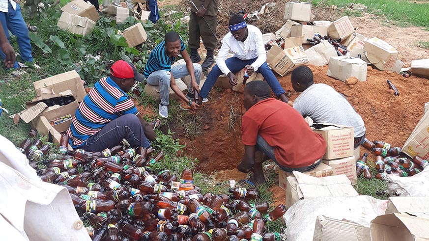 Workers emptying substandard beers in Kimisagara-Eddie Nsabimana