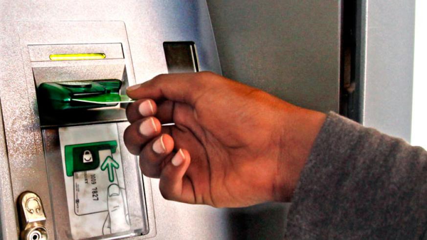 A client withdraws money from an ATM machine. 