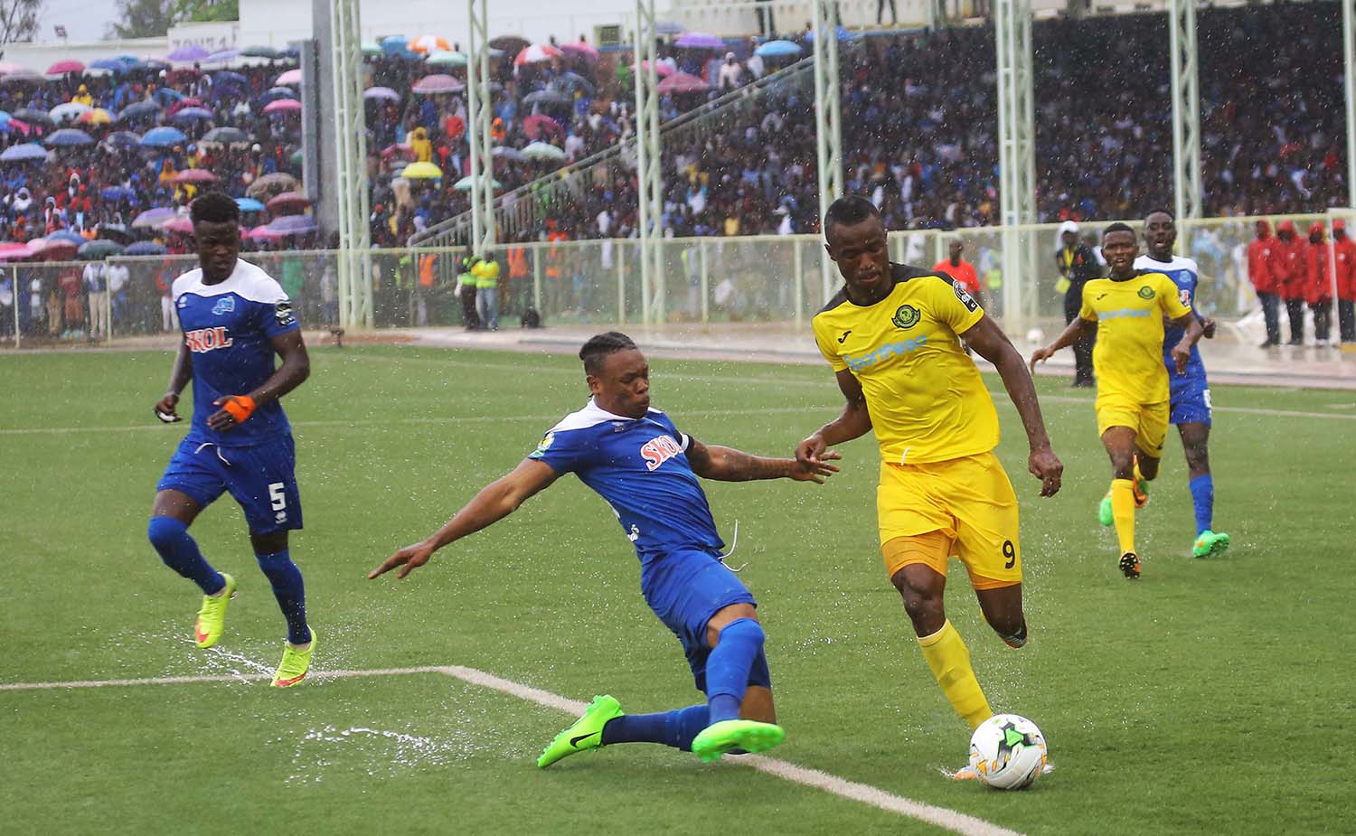 Rayon Sports assistant captain Abdul Rwatubyaye makes a tackle on a Young Africansâ€™ forward during the bluesâ€™ 1-0 victory at Kigali Stadium on August 29. Sam Ngendahimana.