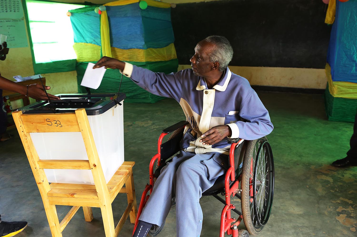 A senior citizen, FranÃ§ois Kana, casts his vote in Gasabo District during this monthâ€™s parliamentary elections.